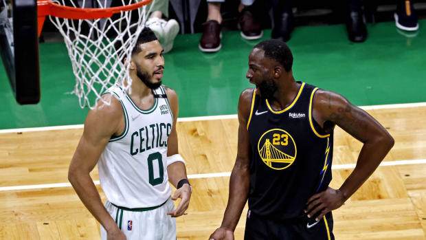 Jun 8, 2022; Boston, Massachusetts, USA; Boston Celtics forward Jayson Tatum (0) talks with Golden State Warriors forward Draymond Green (23) during the second quarter in game three of the 2022 NBA Finals at TD Garden. Mandatory Credit: Winslow Townson-USA TODAY Sports